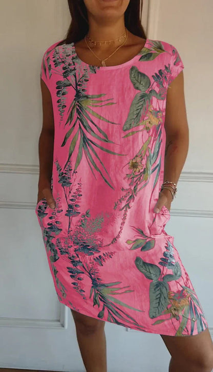 Women's summer dress featuring a vibrant botanical print, designed with convenient pockets, made from a lightweight cotton-linen blend for a relaxed fit, perfect for warm 6