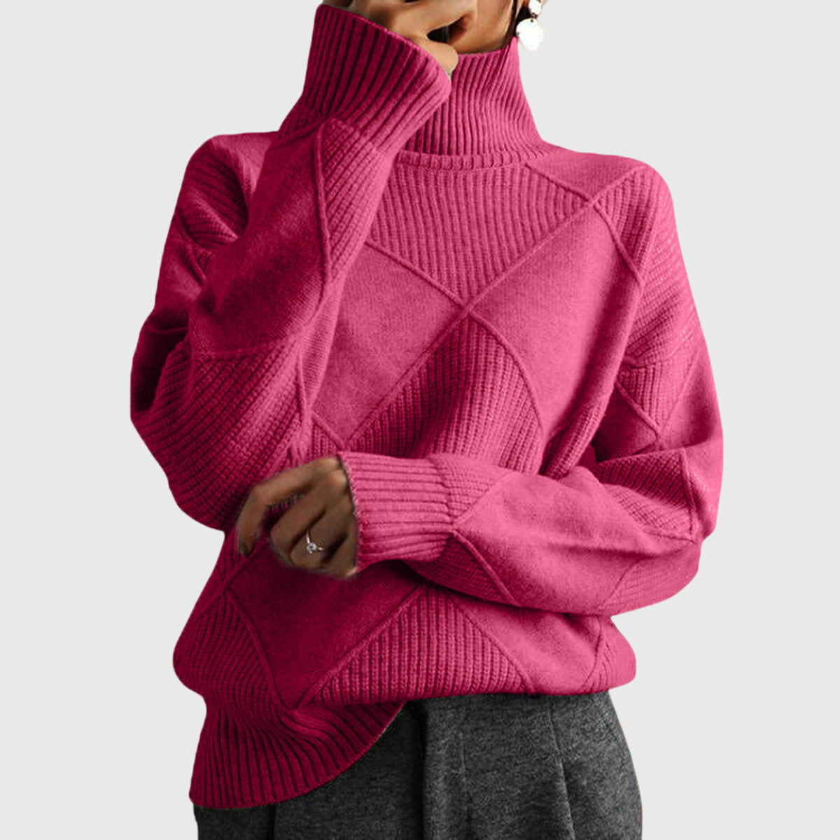 Women’s rose-colored sweater featuring a stylish geometric pattern and a cozy turtleneck design, perfect for comfortable layering in cooler weather. 0
