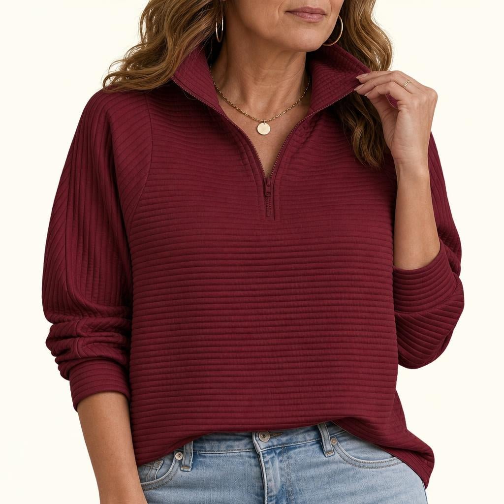 Women's relaxed fit sweater featuring a stylish half-zip design, balloon sleeves, and a cozy funnel neck, perfect for casual outings and layering in cooler weather 1