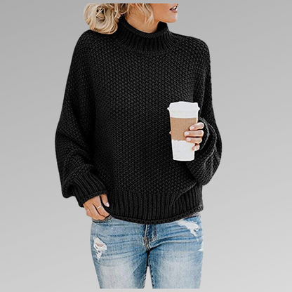 Women's orange high-neck sweater featuring a soft cozy knit and draped fit, perfect for stylish layering in cooler weather. 2