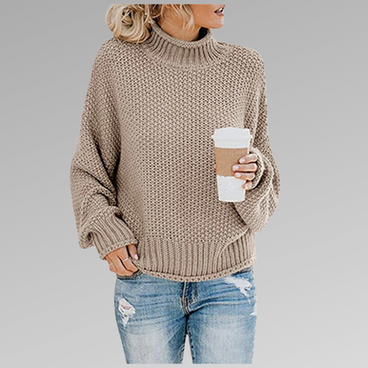 Women's orange high-neck sweater featuring a soft cozy knit and draped fit, perfect for stylish layering in cooler weather. 8
