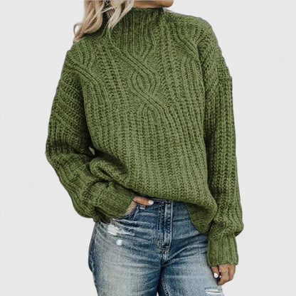 Women's cozy green sweater featuring a relaxed fit and classic cable knit design, perfect for transitional weather. 0