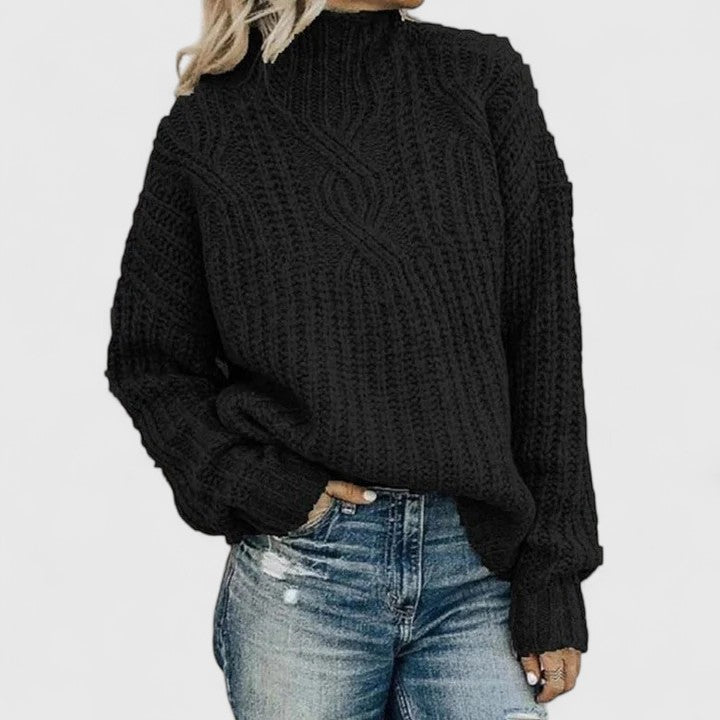 Women's cozy green sweater featuring a relaxed fit and classic cable knit design, perfect for transitional weather. 1