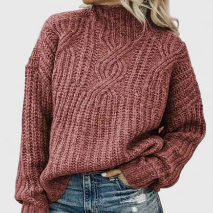 Women's cozy green sweater featuring a relaxed fit and classic cable knit design, perfect for transitional weather. 3