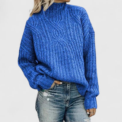 Women's cozy green sweater featuring a relaxed fit and classic cable knit design, perfect for transitional weather. 4
