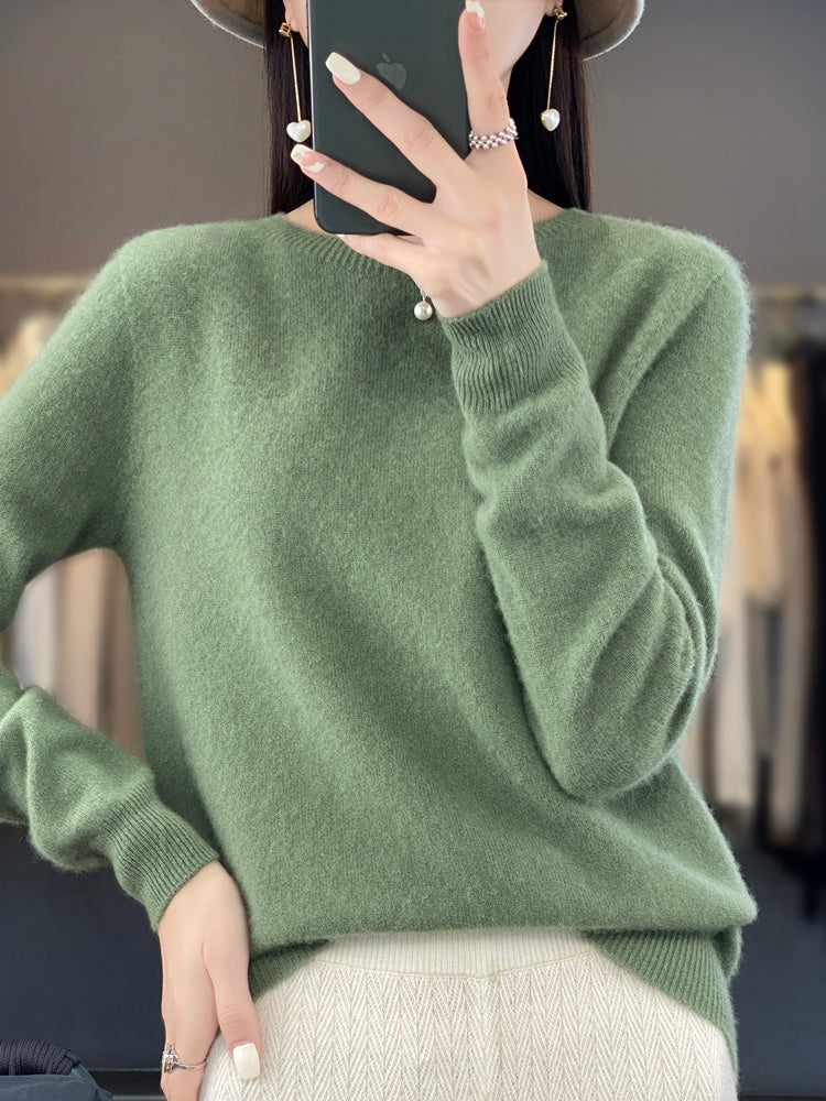 Women’s turquoise sweater featuring a relaxed fit and made from soft, warm material, perfect for cozy layering and versatile styling. 1