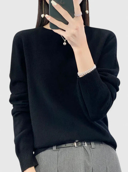 Women’s turquoise sweater featuring a relaxed fit and made from soft, warm material, perfect for cozy layering and versatile styling. 11