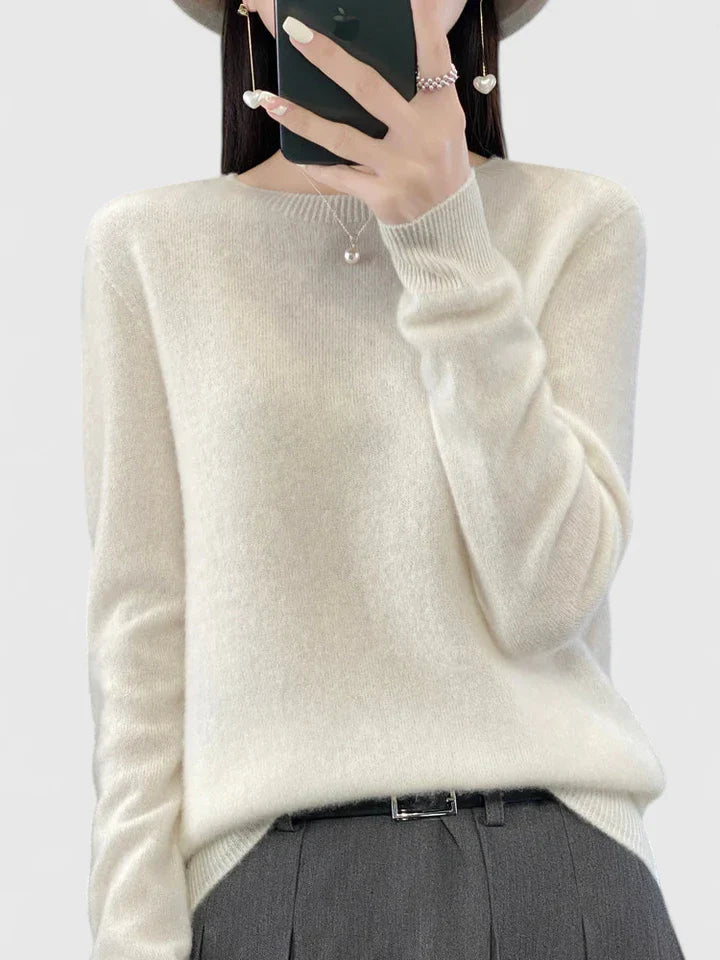 Women’s turquoise sweater featuring a relaxed fit and made from soft, warm material, perfect for cozy layering and versatile styling. 14