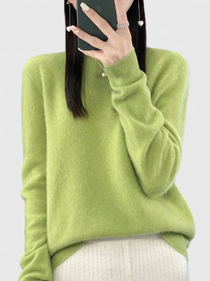 Women’s turquoise sweater featuring a relaxed fit and made from soft, warm material, perfect for cozy layering and versatile styling. 16