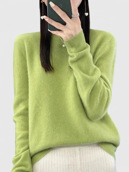 Women’s turquoise sweater featuring a relaxed fit and made from soft, warm material, perfect for cozy layering and versatile styling. 16