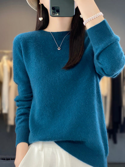Women’s turquoise sweater featuring a relaxed fit and made from soft, warm material, perfect for cozy layering and versatile styling. 2