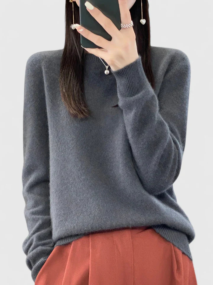 Women’s turquoise sweater featuring a relaxed fit and made from soft, warm material, perfect for cozy layering and versatile styling. 9