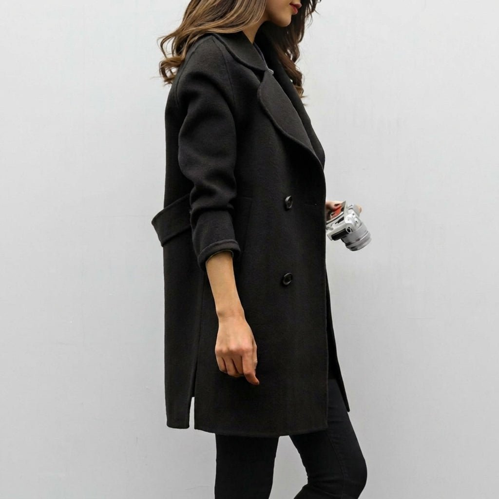 Women's mid-length trench coat featuring a double breasted closure and notched lapel, perfect for stylish warmth during winter. 2