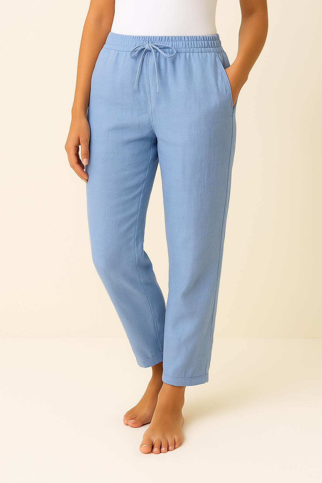 Women's trousers featuring an elastic waist and drawstring, designed in a modern straight leg style for ultimate comfort and versatility. 1