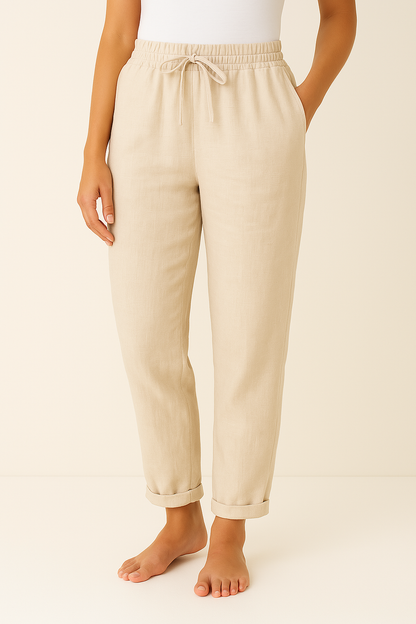 Women's trousers featuring an elastic waist and drawstring, designed in a modern straight leg style for ultimate comfort and versatility. 2