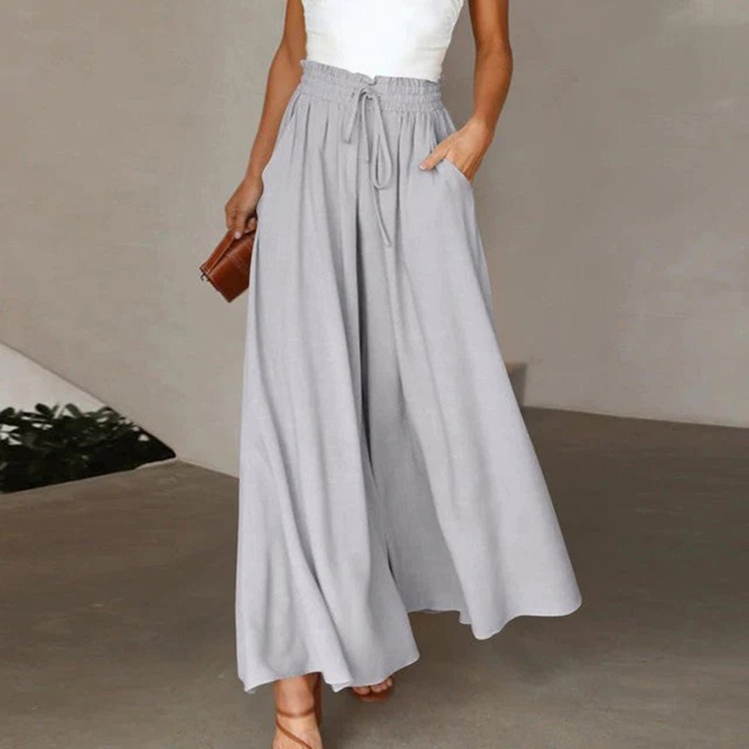 Women's wide leg pants featuring a high waist and drawstring tie, designed in a lightweight and breathable palazzo style, perfect for comfort and effortless elegance. 3