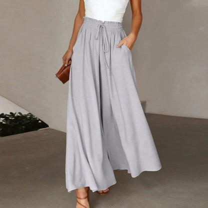 Women's wide leg pants featuring a high waist and drawstring tie, designed in a lightweight and breathable palazzo style, perfect for comfort and effortless elegance. 3