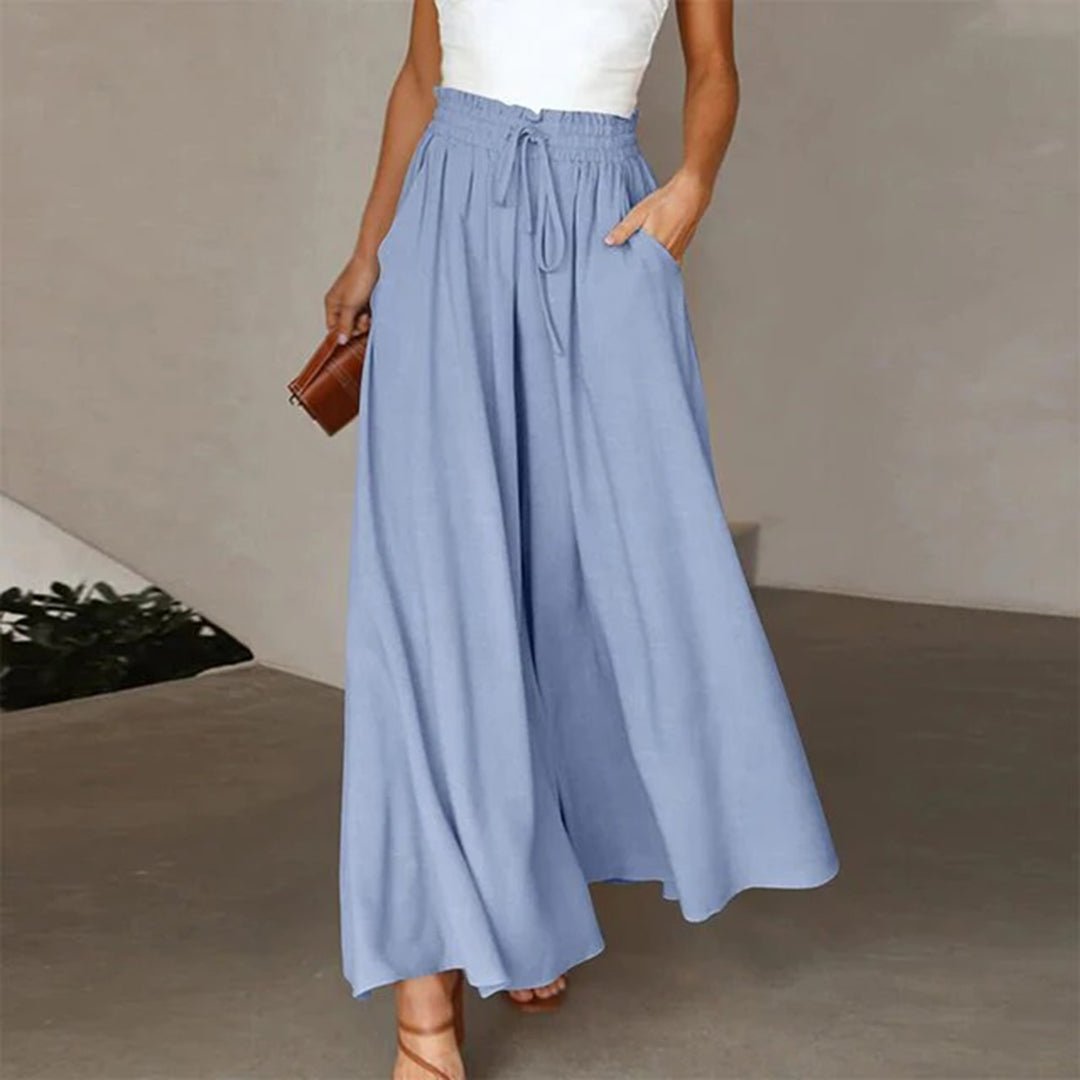 Women's wide leg pants featuring a high waist and drawstring tie, designed in a lightweight and breathable palazzo style, perfect for comfort and effortless elegance. 4