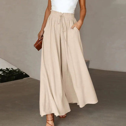 Women's wide leg pants featuring a high waist and drawstring tie, designed in a lightweight and breathable palazzo style, perfect for comfort and effortless elegance. 6