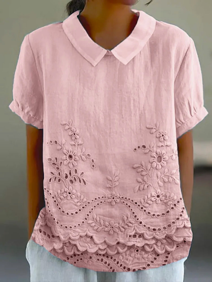 Womens blouse featuring delicate floral embroidery in a soft pink cotton linen blend with a relaxed fit. 0