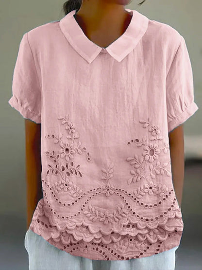 Womens blouse featuring delicate floral embroidery in a soft pink cotton linen blend with a relaxed fit. 0