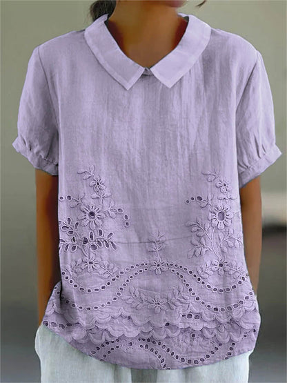 Womens blouse featuring delicate floral embroidery in a soft pink cotton linen blend with a relaxed fit. 4