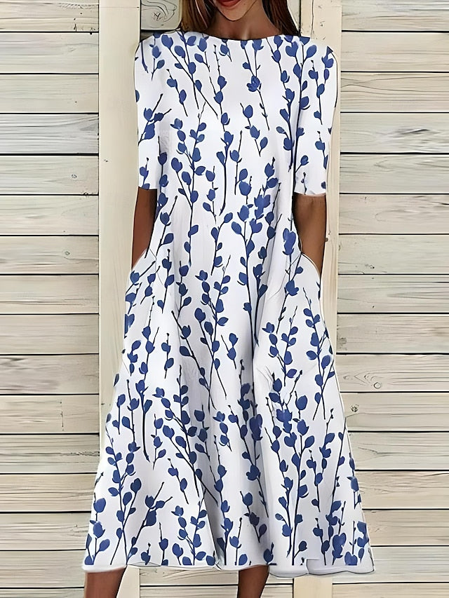 Women’s A-Line mid-length summer dress featuring a vibrant floral print, perfect for casual outings and warm weather occasions. 0