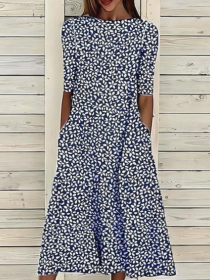 Women’s A-Line mid-length summer dress featuring a vibrant floral print, perfect for casual outings and warm weather occasions. 1