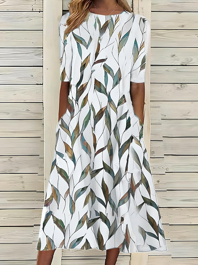 Women’s A-Line mid-length summer dress featuring a vibrant floral print, perfect for casual outings and warm weather occasions. 2
