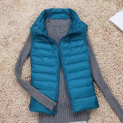 Lightweight women's gilet featuring windproof protection and a fitted design, perfect for layering and outdoor activities. 1