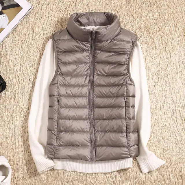 Lightweight women's gilet featuring windproof protection and a fitted design, perfect for layering and outdoor activities. 3