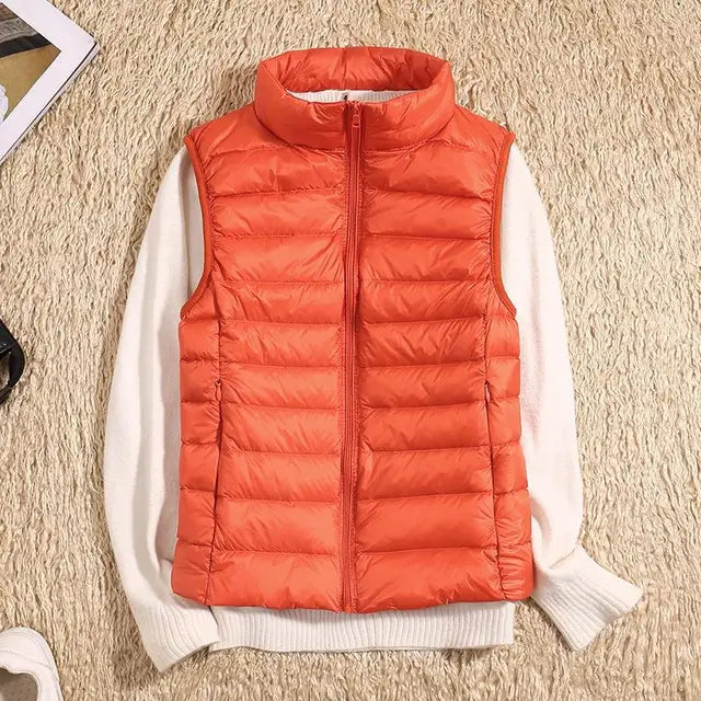 Lightweight women's gilet featuring windproof protection and a fitted design, perfect for layering and outdoor activities. 4