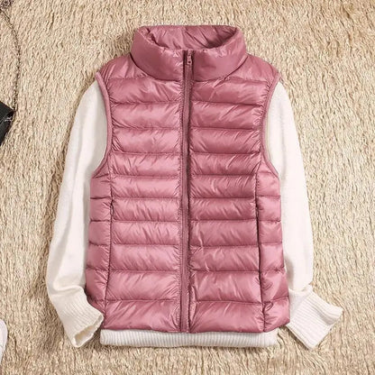 Lightweight women's gilet featuring windproof protection and a fitted design, perfect for layering and outdoor activities. 5