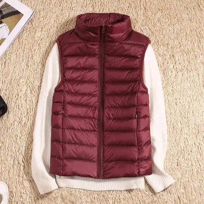 Lightweight women's gilet featuring windproof protection and a fitted design, perfect for layering and outdoor activities. 8