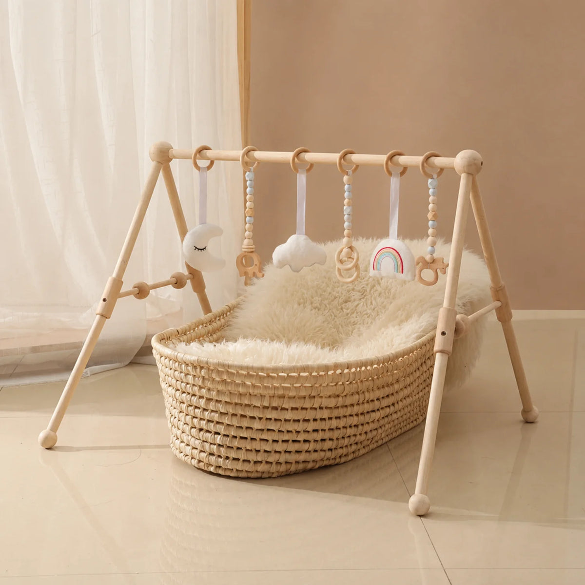 Wooden baby play gym featuring a natural wood minimalist design, equipped with colorful sensory toys for newborn and infant development. 1