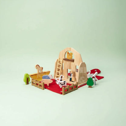 Wooden Travel Farm Playset featuring a barn-shaped case and assorted animal figures, perfect for imaginative play on the go. 3