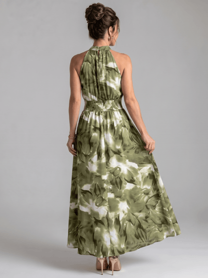 Abstract print midi dress featuring a halter neckline and defined waist, designed with lightweight, flowing fabric for a comfortable and stylish look. 3