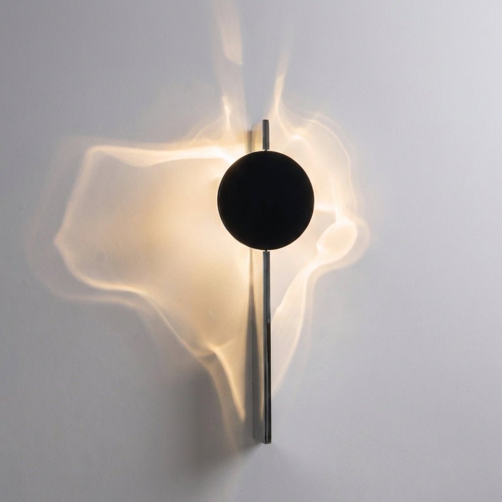 Abstract wall lamp featuring a sculptural metal design and integrated LED lighting, casting unique shadow patterns on the wall. 5