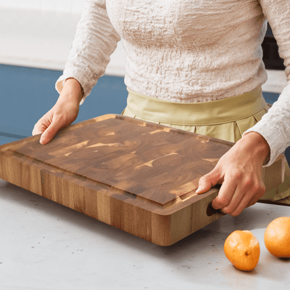 Acacia wood cutting board with a knife-friendly surface, ideal for kitchen prep and durable chopping tasks. 2