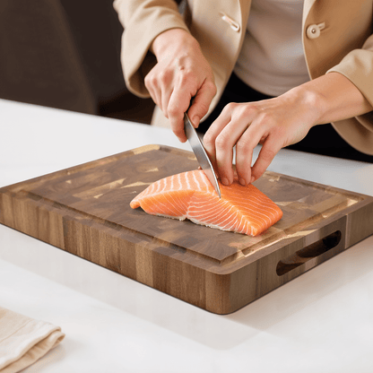 Acacia wood cutting board with a knife-friendly surface, ideal for kitchen prep and durable chopping tasks. 4