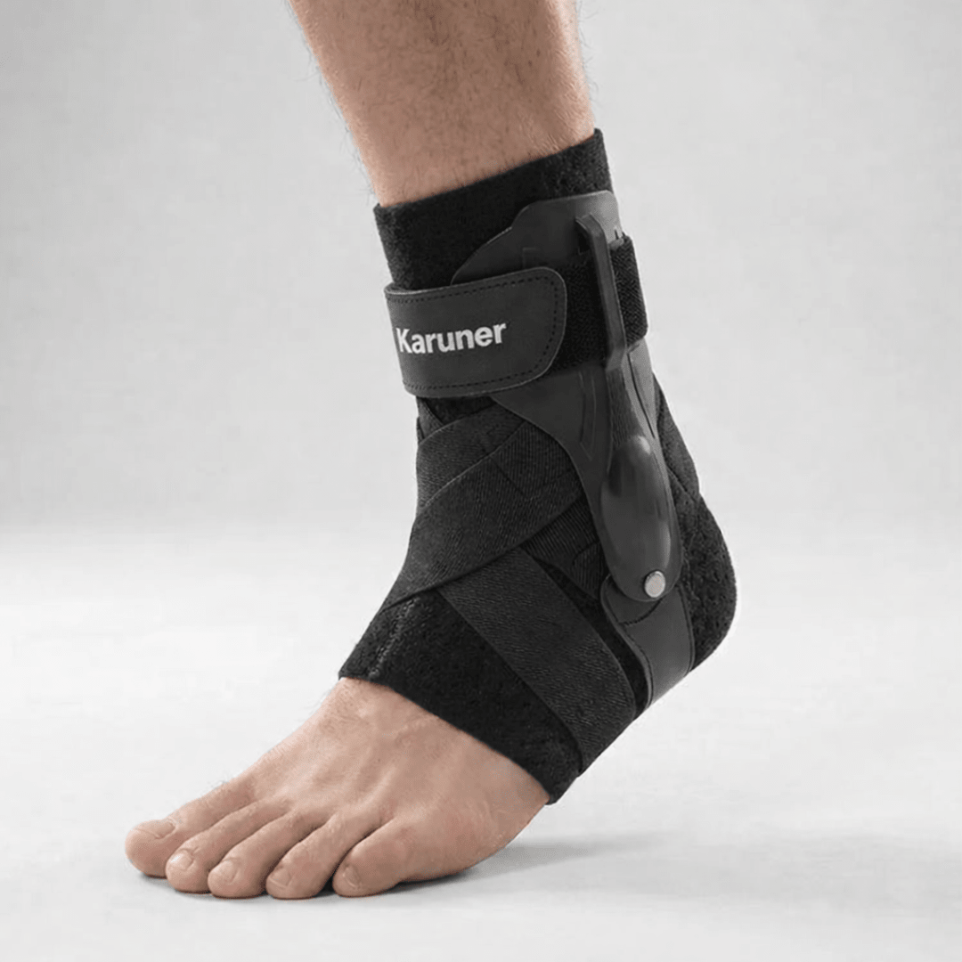 Adjustable ankle support brace with stabilizing straps, featuring a breathable compression sleeve ideal for sports and physical activities. 0