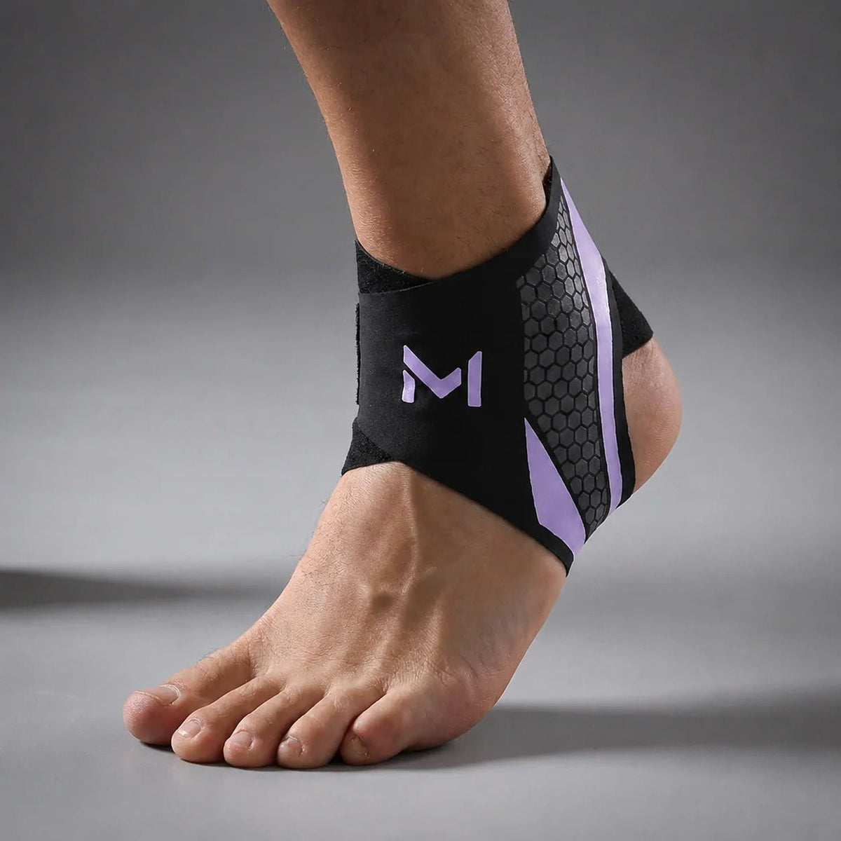Adjustable ankle support sleeve made from flexible nylon blend, designed for targeted compression, ideal for sports and physical activities. 11