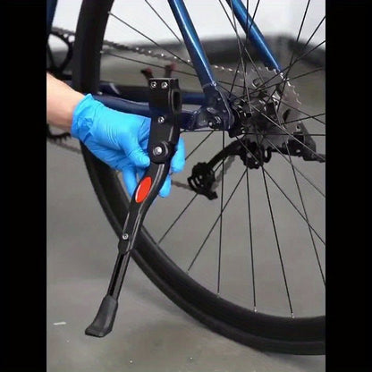 Adjustable aluminum bicycle stand for stable parking, designed to accommodate various bike sizes with a durable kickstand. 7