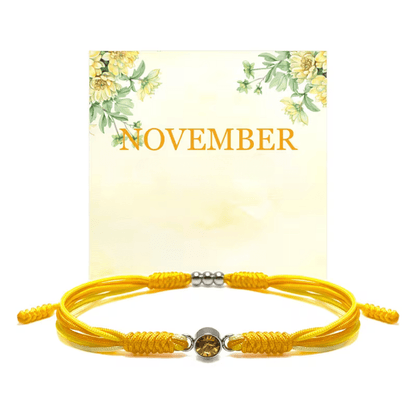 Adjustable birthstone bracelet featuring a sliding closure and an elegant rope cord design, perfect for daily wear and personalized style. 11