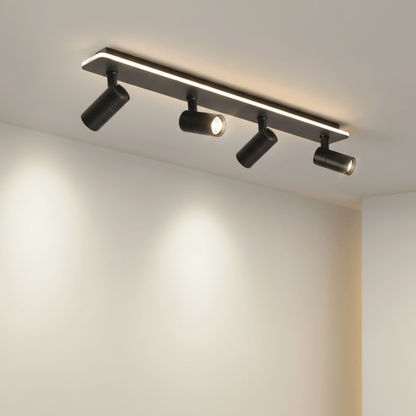 Adjustable LED ceiling lamp featuring a modern industrial design with a sleek metal finish, emitting warm white lighting for a cozy atmosphere. 3