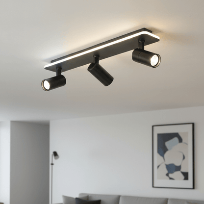 Adjustable LED ceiling lamp featuring a modern industrial design with a sleek metal finish, emitting warm white lighting for a cozy atmosphere. 1