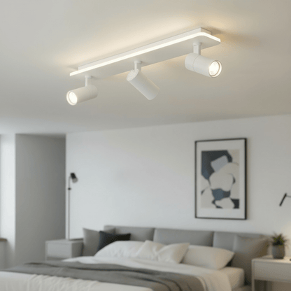 Adjustable LED ceiling lamp featuring a modern industrial design with a sleek metal finish, emitting warm white lighting for a cozy atmosphere. 6