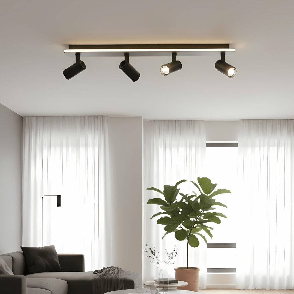 Adjustable LED ceiling lamp featuring a modern industrial design with a sleek metal finish, emitting warm white lighting for a cozy atmosphere. 2