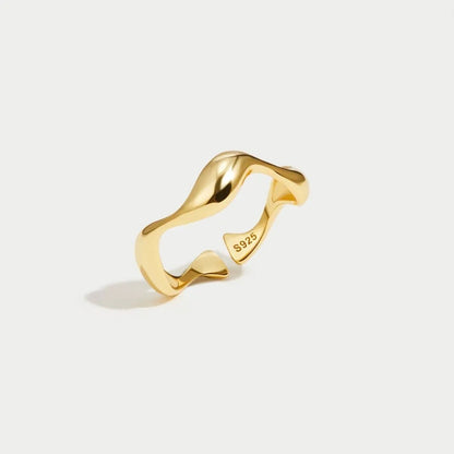 Adjustable minimalist ring in 18K gold plated sterling silver featuring an ocean-inspired design, perfect for elegant and modern jewelry collections. 3