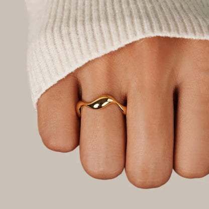 Adjustable minimalist ring in 18K gold plated sterling silver featuring an ocean-inspired design, perfect for elegant and modern jewelry collections. 1